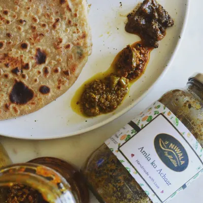 This is what pure comfort looks like. A customer sent me this picture of a delicious paratha served with three of my pickles. It’s wonderful to see my Amla ka Achaar and other creations becoming a part of your daily meals.