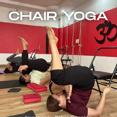 Chair yoga is a powerful tool for everyone. Here, my students are using chairs to support themselves in an inversion, which helps with pelvic opening and blood circulation without putting any strain on the neck or back.