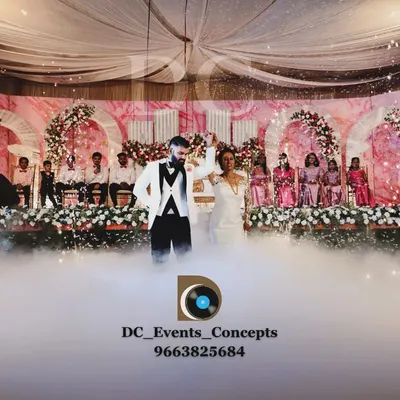 A perfect shot of our special effects in action. We use cold fire pyrotechnics and low-lying fog to create a spectacular and safe grand entrance for the wedding couple, ensuring a truly magical moment.