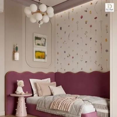 A dreamy child's room featuring a scalloped magenta headboard and whimsical floral wallpaper, creating a space that is both playful and chic.