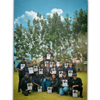 Our team of K9 coaches proudly holding our training certifications. We are committed to professional development and staying updated on the best dog behavior modification and training techniques.