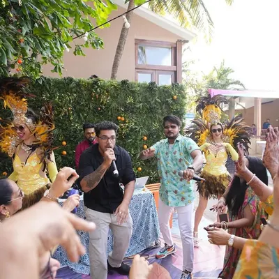 Leading a high-energy carnival party in Goa. With dancers, rappers, and a great DJ, we created an epic daytime bash for all the guests.
