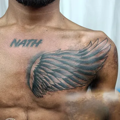 A successful birthmark cover-up on dark skin. This wing tattoo was designed to completely hide the birthmark on the client's chest, demonstrating my ability to work with different skin types and challenges.