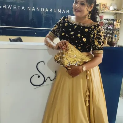 A full view of the black velvet and gold silk lehenga I designed for my brother's sangeet, pictured in my studio.
