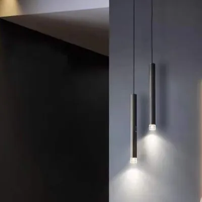 A pair of minimalist pendant lights, perfect for hanging over a bedside table or in a cozy reading corner.