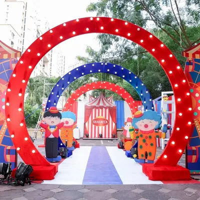 Step right up! This multi-arched carnival entrance with bright lights and character cutouts immediately set the tone for a fun-filled 10th birthday party. First impressions are everything!