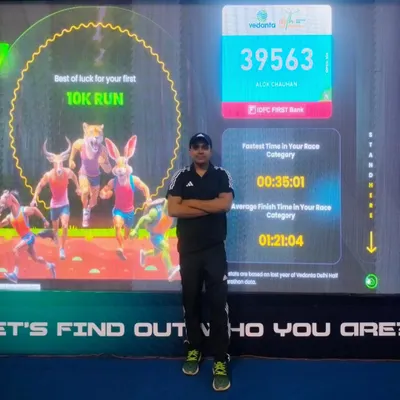 At the Vedanta Delhi Half Marathon expo, checking my stats from previous years. I am always looking to improve, just like I push my clients to do.
