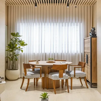 The Director's Room in 'The Terra Office' is designed for collaboration and leadership. A central round table, clean wooden interiors, and sheer curtains create an inspiring hub for innovative discussions.