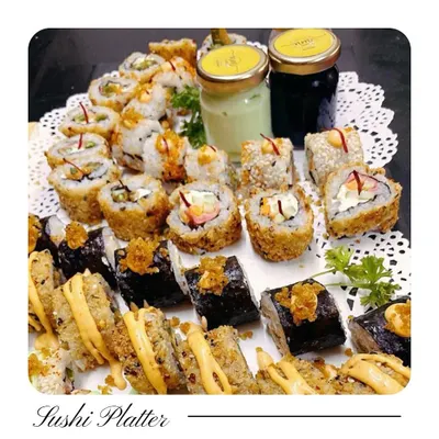 My vegetarian Sushi Platter is a feast of textures and flavours. It includes a variety of rolls like Veg Tempura, Asparagus, and Avocado, served with wasabi and soy sauce for the complete experience.