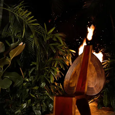 The Vismayam chair, photographed here with fire, evokes the spirit of Theyyam, the ritual art form that inspired it. The chair is an embodiment of the reverence and awe we feel for this powerful cultural tradition.