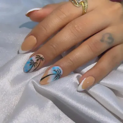 Ready for Goa! I hand-painted these beach-themed nails with palm trees against a blue sky, paired with a nude and white French manicure.
