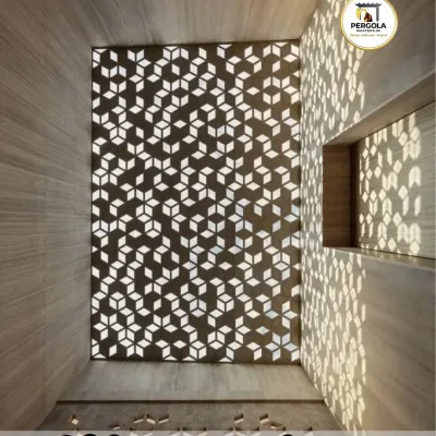 This skylight features a custom CNC-cut panel with a repeating 3D cube pattern. We designed it to cast intricate, geometric shadows on the walls and floor, creating a piece of living art that changes with the sun's movement.