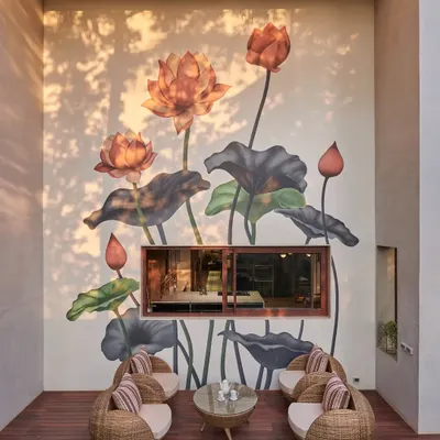This beautiful lotus mural was created for a private home, turning an outdoor seating area into a peaceful oasis. The soft colors and elegant composition complement the garden surroundings perfectly.