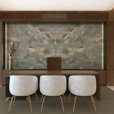The main desk area in the Chairman's office for AMC Group, where a stunning book-matched marble feature wall creates a powerful backdrop. The design combines natural materials with clean lines for a look of modern authority.
