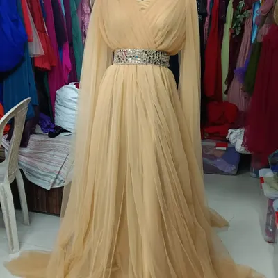 This is my Golden Angel wings gown, perfect for a pre-wedding or maternity shoot. The long, flowing sleeves create a beautiful wing-like effect.