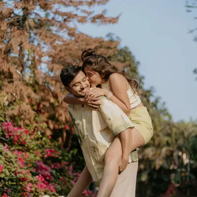 A joyful piggyback ride is the perfect way to capture your fun-loving spirit. We encourage playful interactions to get those genuine smiles and laughs during your pre-wedding shoot.