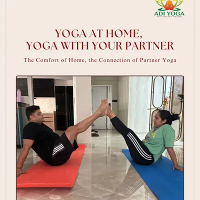 The comfort of home, the connection of partner yoga. This couple is building core strength and trust together, showing how you can turn your living room into a space for shared wellness.