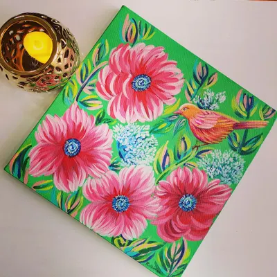 A finished acrylic painting on canvas, featuring a colorful bird amidst vibrant pink flowers. This piece showcases the lively and detailed style I teach in my canvas painting classes for adults and teens.