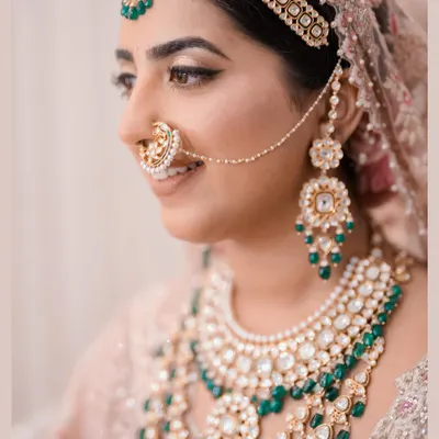 A bride's jewelry tells a story of heritage and personal style. I guided the selection of this intricate kundan and emerald set, ensuring it complemented the pastel Tarun Tahiliani outfit and completed a look of regal elegance.