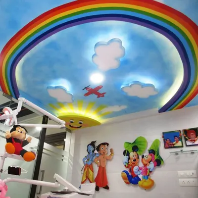 I painted this cheerful sky and rainbow mural on the ceiling of a children's dentist clinic. The goal was to create a friendly and distracting view for young patients, making their experience less stressful and more pleasant.