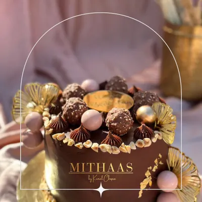 A close-up of my Ferrero Rocher cake, a true indulgence for chocolate and hazelnut lovers. The cake is topped with whole Ferrero Rochers, toasted hazelnuts, and delicate chocolate piping, making it a luxurious centerpiece.
