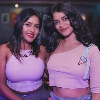 Posing with a friend during a fun karaoke night. I love the community that builds around these music events.