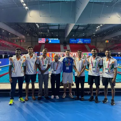 Team India, featuring our Dronacharya Awardee coach Pradeep Kumar and swimmer Shoan Ganguly, at the World Aquatics Swimming Championship in Singapore. We are proud to have our coaches and athletes leading the charge internationally.