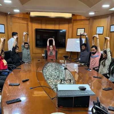 Bringing a moment of calm to the corporate world. This is a session with the team at SMC Global, where we practiced simple stretches and breathing exercises right in the conference room to relieve desk-related stress.