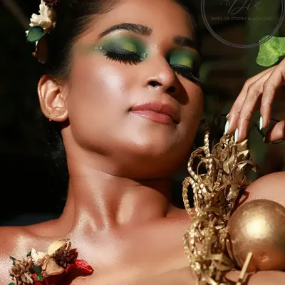 A close-up of my nature-inspired creative makeup. You can see the detailed blending of green eyeshadows and the delicate placement of floral elements to create a cohesive, artistic look.