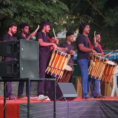 Our drummers on stage, set up with a professional sound system for a DJ Chendamelam performance. This modern take on a traditional art form is guaranteed to make your event a party.