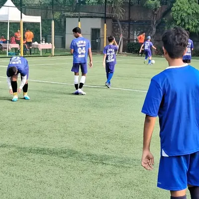 Our team playing a competitive match against the American Embassy School team. These high-stakes games are the ultimate test of our training.