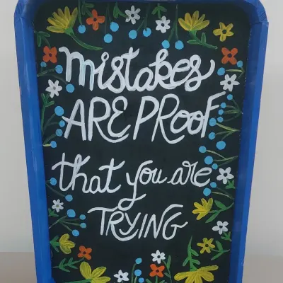 This is a piece of my own artwork with a message I truly believe in: "Mistakes are proof that you are trying." I want every child to know that our studio is a safe space to try new things without fear of getting it wrong.
