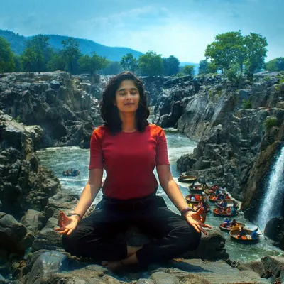 Finding complete serenity while meditating by a powerful waterfall. These are the moments of profound connection that my nature retreats are built around.