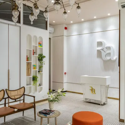 The reception at Ra Clinic sets a serene and luxurious tone from the moment a client arrives. I used fluted white walls, a custom reception desk, and elegant arched shelving to create a clean, sophisticated look. The space is designed to be a calming welcome, blending comfort and high end aesthetics seamlessly.