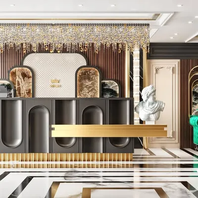 A wide shot of the jewellery showroom's reception and waiting area. The image showcases the custom-designed desk with gold accents and the luxurious green velvet sofa.