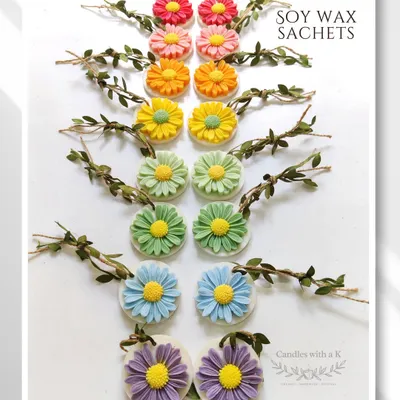 A rainbow of my daisy flower soy wax sachets, a beautiful and fragrant alternative to candles for return gifts.