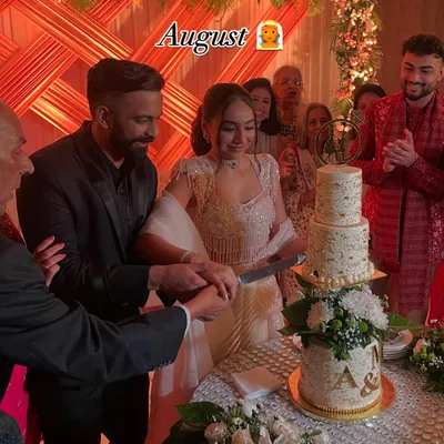 It was an honor to create this stunning tiered wedding cake for this beautiful couple's big day. Adorned with fresh flowers and a custom monogram, it was the perfect centerpiece.