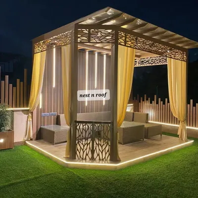 This is the definition of outdoor luxury. A custom-designed gazebo with intricate laser-cut metalwork, elegant curtains, and sophisticated backlighting creates a perfect private retreat.