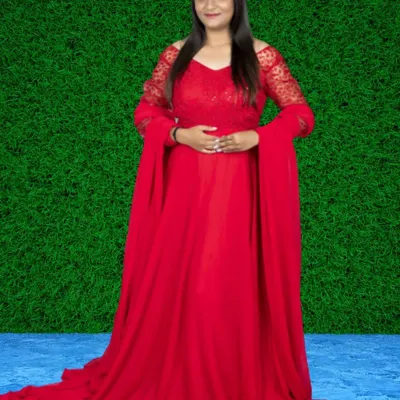 Make a bold entrance in this stunning red gown. It features a lace bodice and dramatic cape-like sleeves that flow down to the floor.