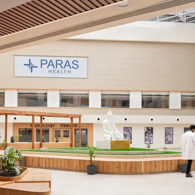 The landscaped central courtyard at Paras Yash Kothari Hospital serves as a green lung for the facility. It provides a serene space for reflection and social interaction, while allowing natural light to permeate the surrounding clinical areas.