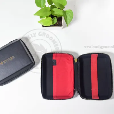 Keep your tech organized with our custom pouches. This one, designed for Zynga, features a durable exterior and a vibrant red interior with elastic straps to hold cables and accessories securely.