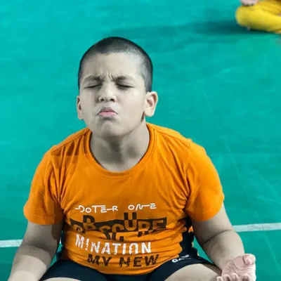 This is the look of pure focus. I teach my students meditation techniques to help them stay calm and centered during intense competition. A strong mind is a player's greatest asset.