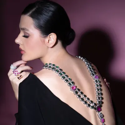 A dramatic back shot from a creative photoshoot. I styled this look to showcase how a necklace can be worn in an unconventional way, draping it down the back of a backless dress to create a unique and breathtaking statement.