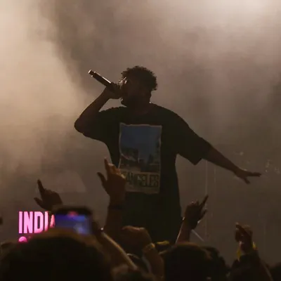 Lost in the smoke and the sound. This is the moment I live for, commanding the stage and feeling the bass at a live desi hip-hop concert.