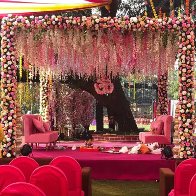 A beautiful floral vidhi mandap, rich with tradition and meaning. We used cascading wisteria and dense floral pillars to create an intimate and sacred setting for the wedding pheras in Lonavala.