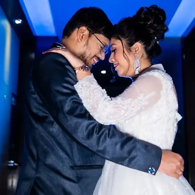A stylish, cinematic shot from a Catholic wedding reception. We use creative lighting and composition to add a touch of modern artistry to your wedding album, telling your story with elegance.