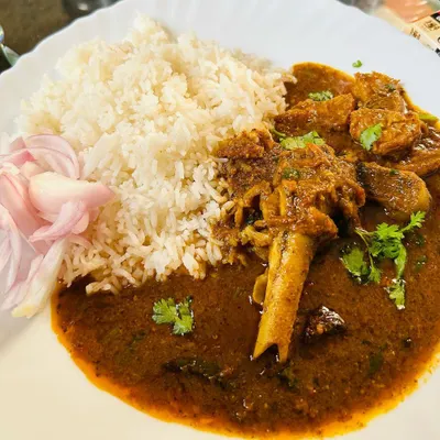 My signature Mutton Curry, slow-cooked for hours until the meat is tender and falling off the bone. The thick, spicy gravy is made with my special blend of home masalas and is perfect with a plate of simple steamed rice.