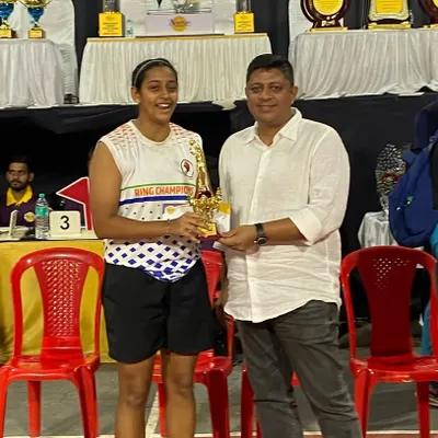 Presenting the MVP award to a deserving player from our champion Women's Team. Recognizing individual excellence is a key part of our events.