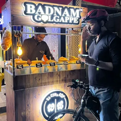 A pit stop at 'Badnam Golgappe' for some delicious pani puri with six different flavors of water. Discovering new food spots is a tasty perk of our night rides.