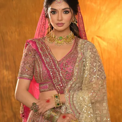 A blushing beauty in pink from a recent creative shoot. This look features a full glam style with a focus on a flawless base and defined eyes, perfect for a destination wedding vibe.